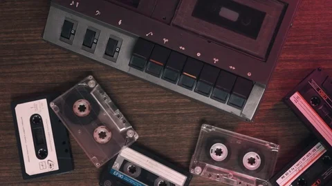 Man's hand inserting the audio cassette into the retro tape Portable Vintage Stock Footage 113746041