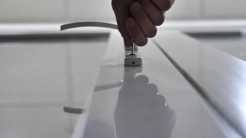 Man's hand inserting a key into the keyhole and trying to open the door lock Stock Footage 261028173