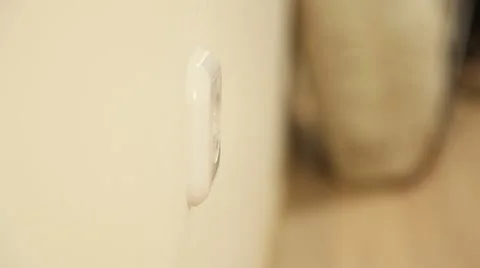 Man's hand inserts a plug into a socket Stock Footage 61269125