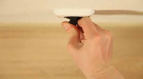 Man's hand inserts a plug into a socket Stock Footage 61269197