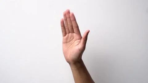 Man's hand with an inviting or shooing gesture on a white background Stock Footage 262434647