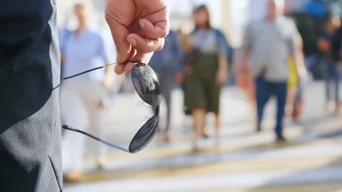 Man's hand keep a frame from sunglasses. Close up shot. Stock Footage 112604335