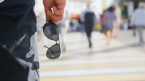 Man's hand keep a frame from sunglasses. Close up shot. Stock Footage 112607778