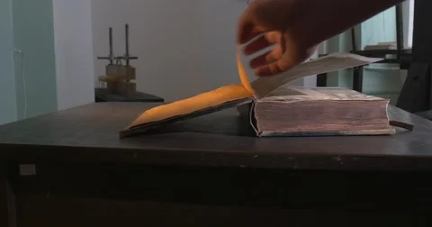 Man's Hand is Leafing through the Old Book, Video Filming of Historical Book. Stock Footage 52340211