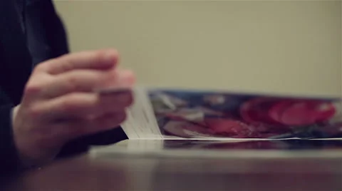 Man's hand leafing through a pages of the magazine. Stock Footage 62927716