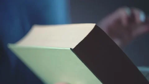 Man's hand leafing through the pages 4K Stock Footage 205569157