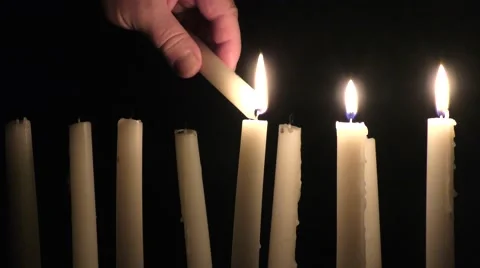 Man's hand lighting candles Video stock 57674185