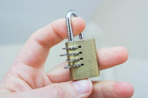 Man's hand with a lock Stock Photos
