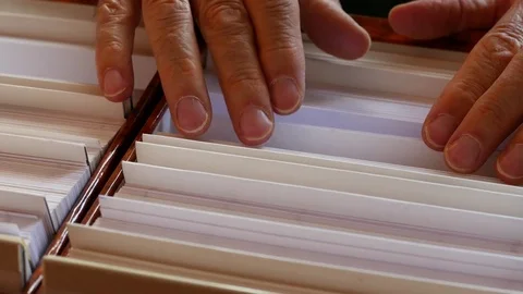 Man's hand looking at a file Stock Footage 80283046