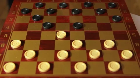A man's hand makes a checkers step close-up Stock Footage 260634329