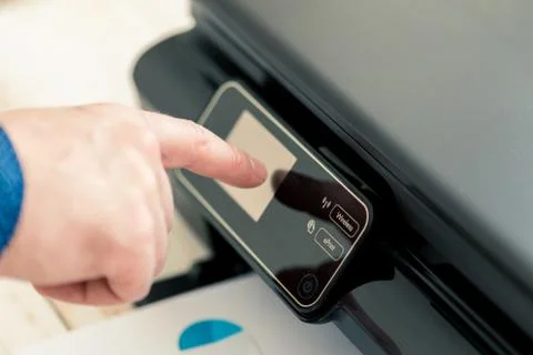 Man's hand making copies. Working with printer Stock-Fotos
