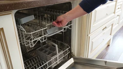 A man's hand opens and closes the built-in dishwasher door. Bosch Stock Footage 196727915