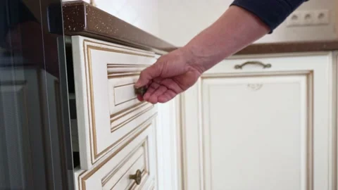 A man's hand opens and closes the kitchen drawer with BLUM fittings. Stock Footage 196909910