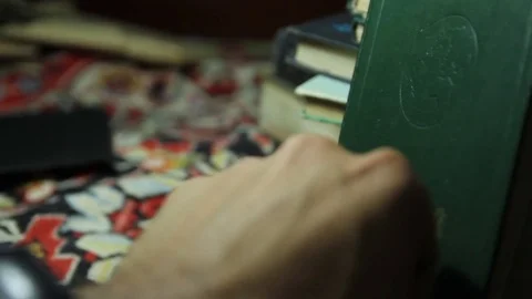 Man's hand opens the book with maps Video stock 72774768