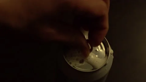 Man's hand opens a can with beer. Macro close-up. Stock Footage 132137043
