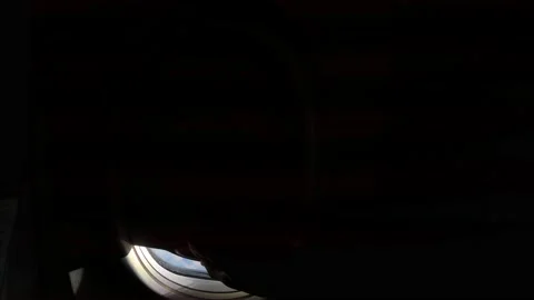 A man's hand opens the curtain, opening the curtains of the airplane window Stock Footage 194856735