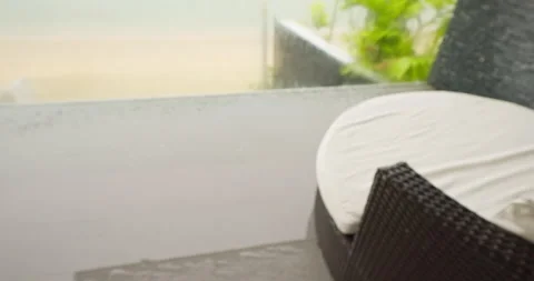 A mans hand opens the door and goes out to the balcony overlooking the beach Stock Footage 310634207