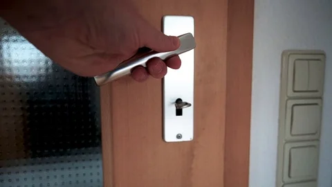 The mans hand opens a door Stock Footage 121531340