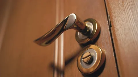 A man's hand opens the door by the handle Stock Footage 136550643