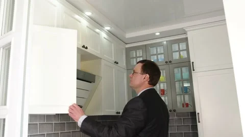 Man's hand opens the kitchen bedside table. Empty kitchen bedside table in a Video stock 131158347