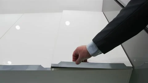 Man's hand opens the kitchen bedside table. Empty kitchen bedside table in a Video stock 131456950