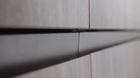 A man's hand opens the kitchen Cabinet door Видео 130346323