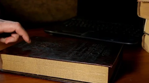 A man's hand opens a mini safe in the form of a book Stock Footage 85400845