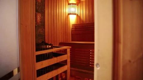 Man's hand opens the sauna door Stock Footage 168152597