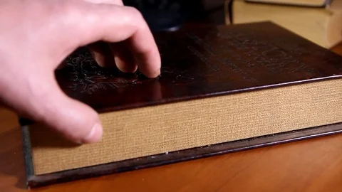 A man's hand opens a secret safe and pulls out a banknote Stock Footage 83273977