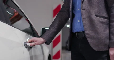 The man's hand opens the side door of the car Video stock 169570281