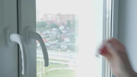 Man's hand opens the window Stock Footage 132495510
