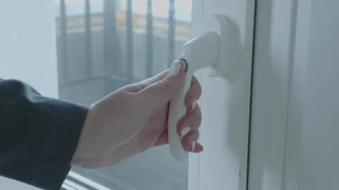 Man's hand opens the window Stock Footage 132495522
