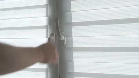 A man's hand opens a window in the room. Stock Footage 183265576