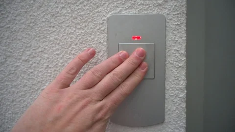 Mans hand operates switch for an elevator Stock Footage 121531294