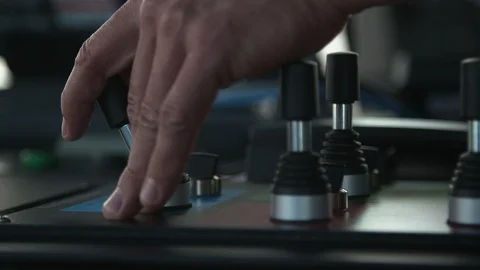Mans hand operating control panel switches Stock Footage 116468028