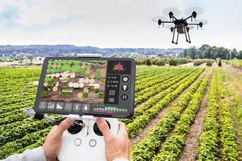 Man's Hand Operating The Quadrocopter Stock Photos