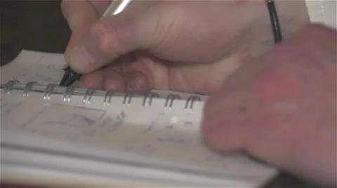 Man's hand with a pen made records in the notebook. Video stock 62500442