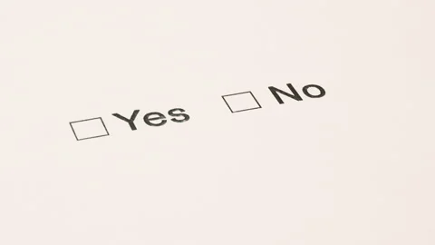 Man's hand with a pen over the document, select Yes or No. Stock Footage 107384998