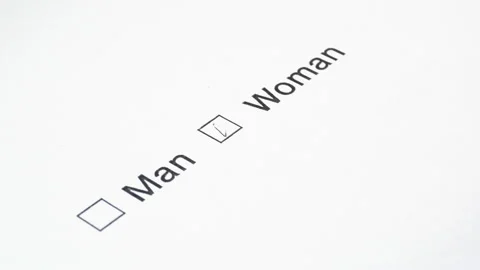 Man's hand with a pen over the document, select your gender. Vídeos de archivo 107385022
