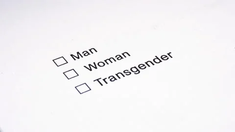 Man's hand with a pen over the document, select your gender. Видео 107385252