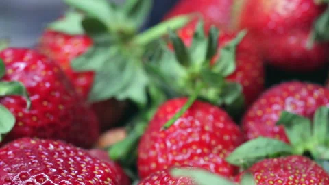 A Man's Hand Picks Strawberries From A Plastic Box On The Kitchen Table.  Stock Footage 246864418