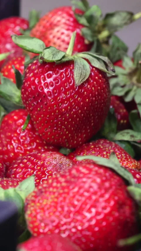 A Man's Hand Picks Strawberries From A Plastic Box On The Kitchen Table.  Vertic Stock Footage 270310491
