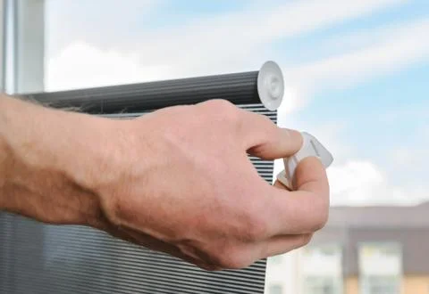 Man's hand with  a plastic bracket. Stock Photos