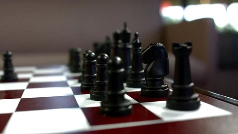 Man's hand playing chess Stock Footage 93519020