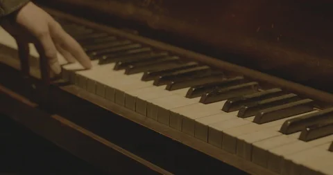 Man's hand playing the piano Stock Footage 97927892