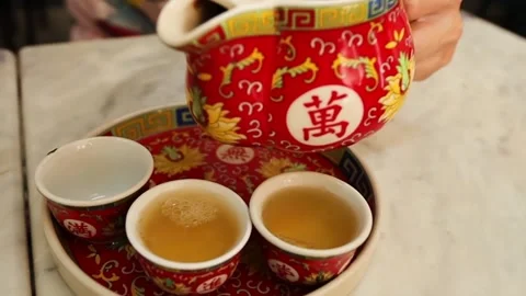Man's hand pouring Chinese tea close up. Stock Footage 264308711