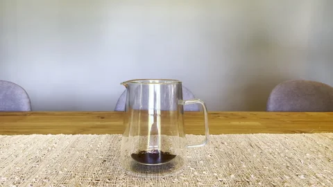 Man’s Hand Pours Coffee Grounds into Glass Scandinavian French Press Stock Footage 249122306