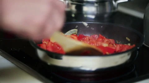 Mans hand preparing salsa in his kitchen, steadicam shot Видео 36637743