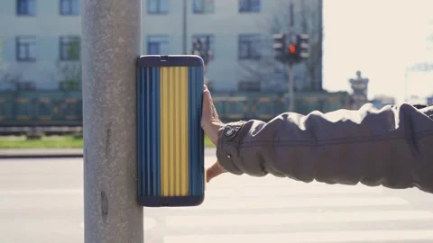 A man's hand presses a button on a pedestrian crossing. Stock Footage 246642814