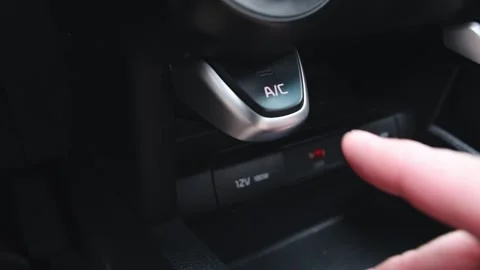 Man's hand presses the button to turn off the air conditioner in the car. Stock Footage 287297345